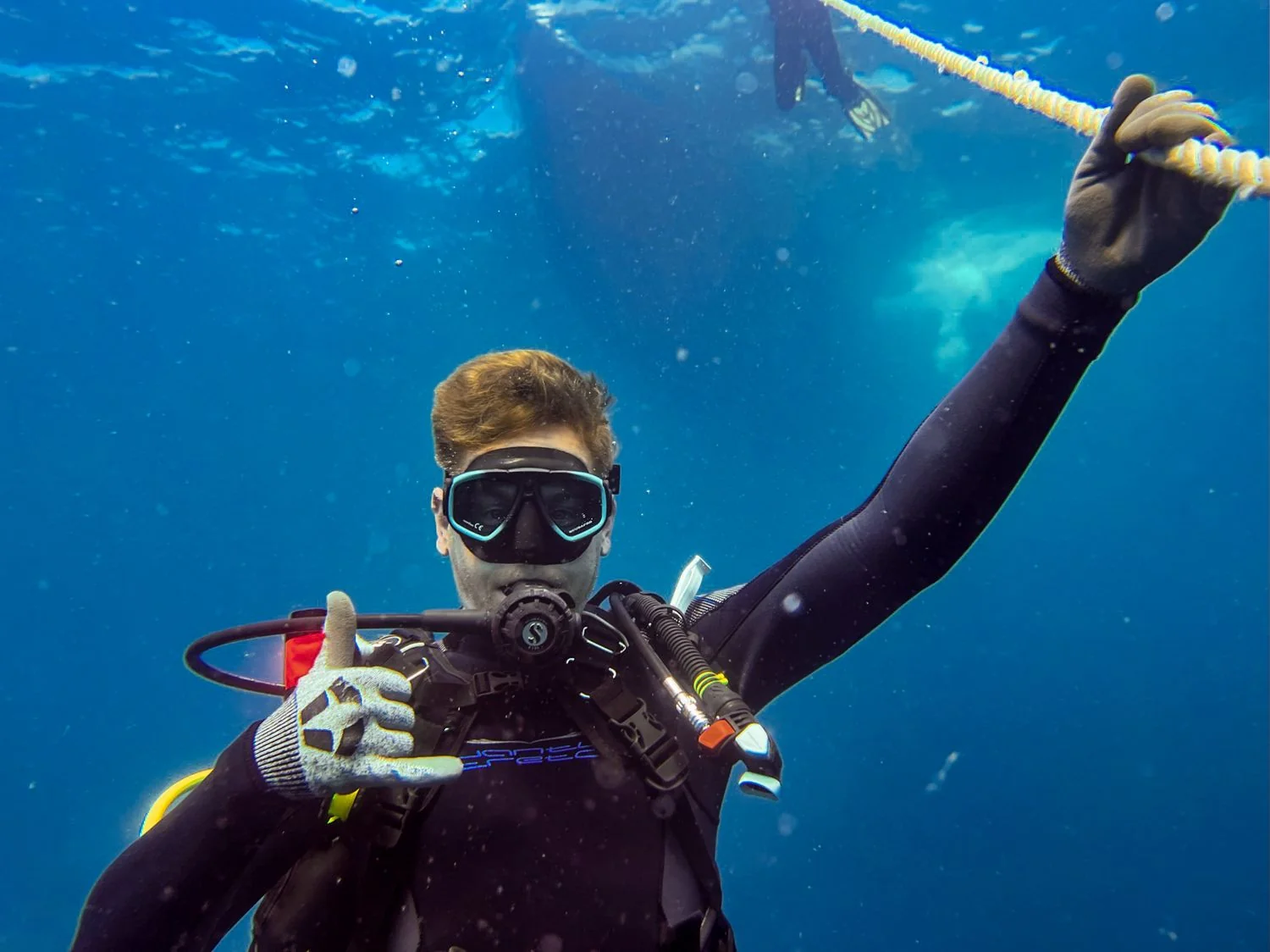 Scuba-diving photograph from Cody’s existing About page.