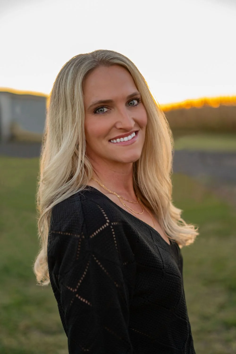 Outdoor portrait of a woman in warm evening light.