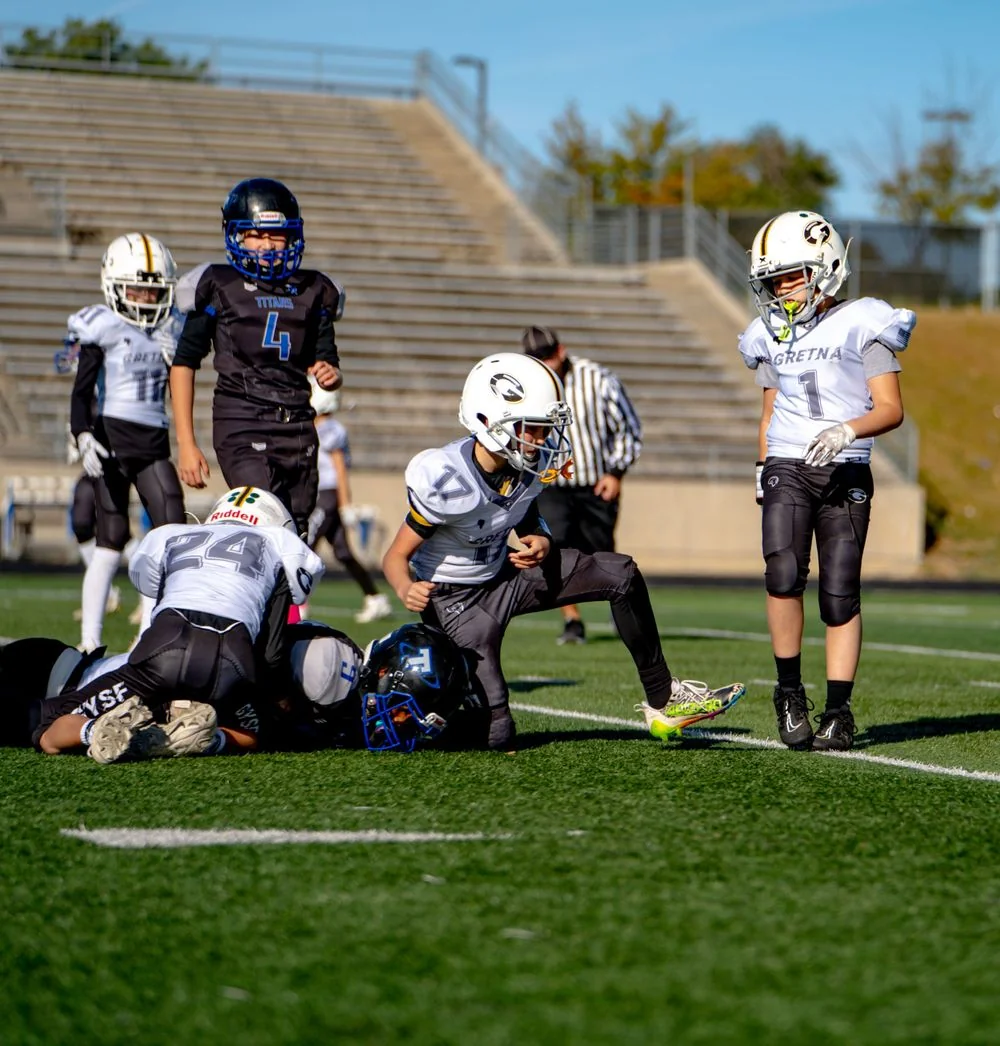 Football players regrouping after a play.